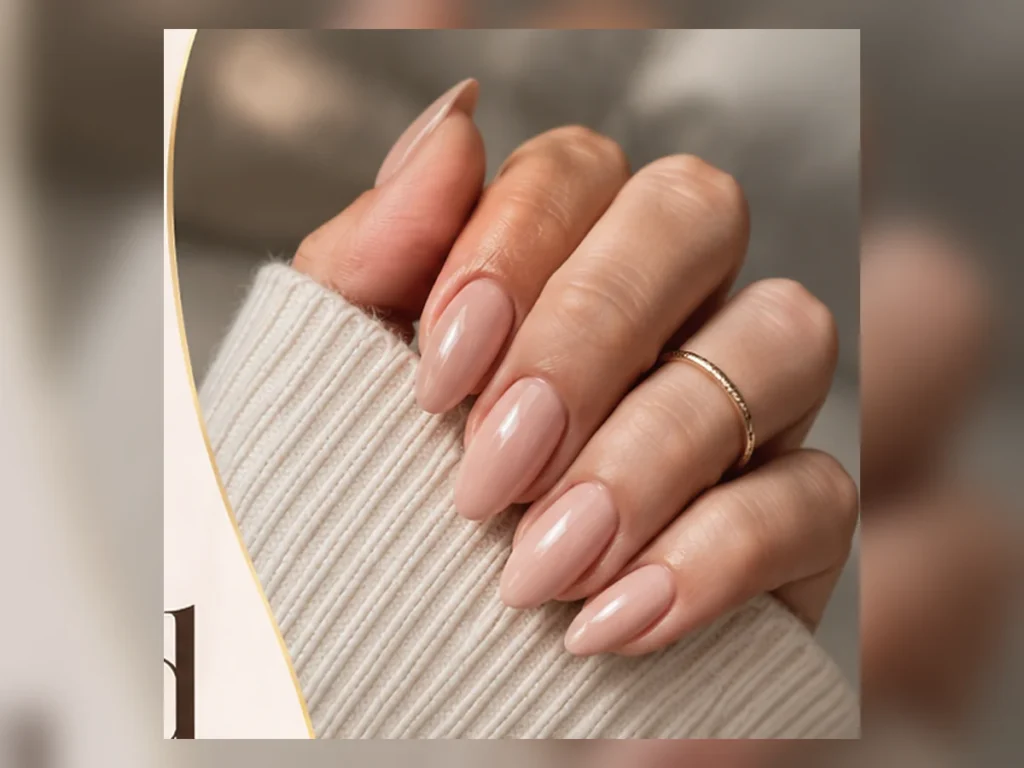 Milky nude almond-shaped nails with a glossy finish